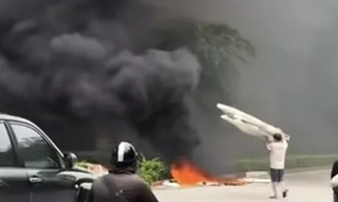 Xử phạt người đốt rác khói đen bao trùm cầu Thăng Long